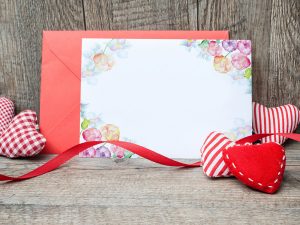 Free-Lovely-Greeting-Card-Mockup-Placing-on-Wood